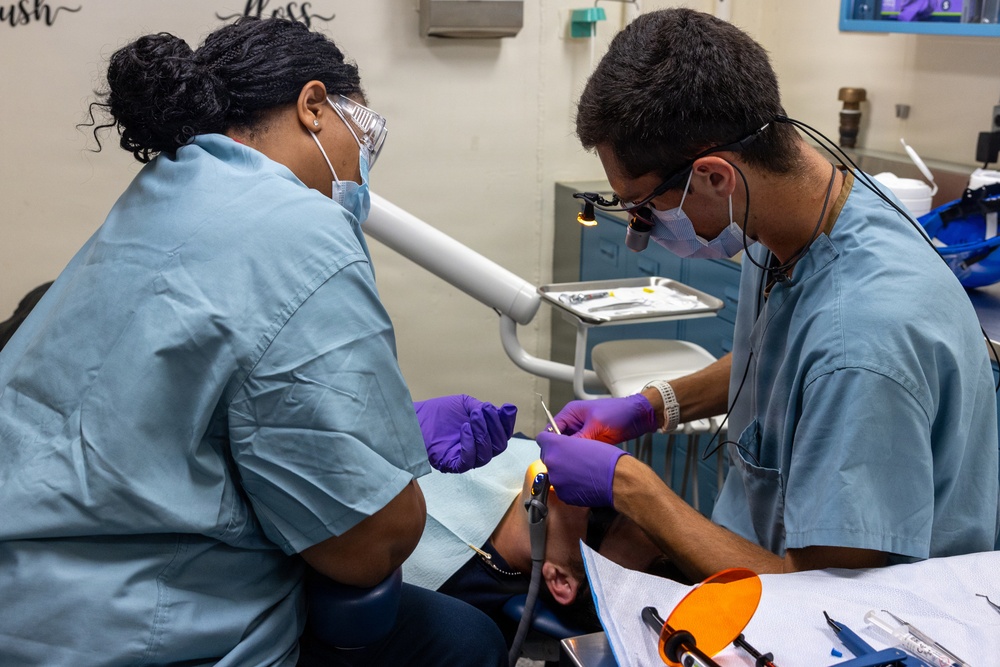 Dentist performs filling aboard PCU John F. Kennedy