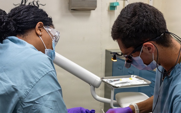 Dentist performs filling aboard PCU John F. Kennedy