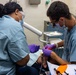 Dentist performs filling aboard PCU John F. Kennedy