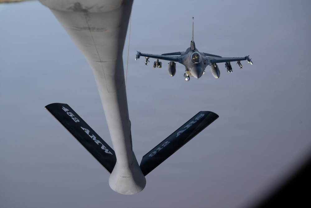 KC-135 refuels F-16s in support of regional security