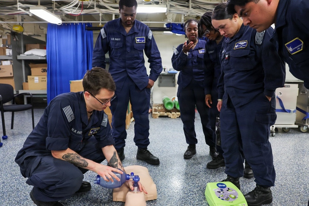 U.S. Navy Sailors conduct CPR Training evolution.