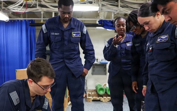 U.S. Navy Sailors conduct CPR Training evolution.