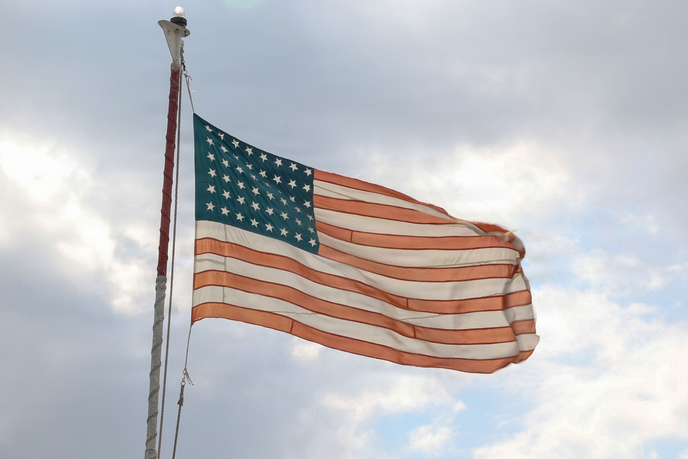 Flag made by POWs flies over Bataan