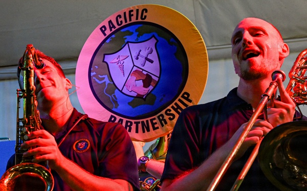 Pacific Partnership Band performs at Timor Plaza Night Market in Dili, Timor-Leste