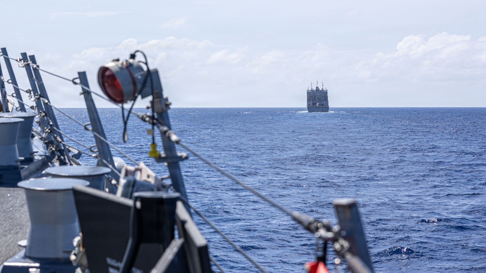 USS Mustin conducts a replenishment-at-sea with USNS Wally Schirra
