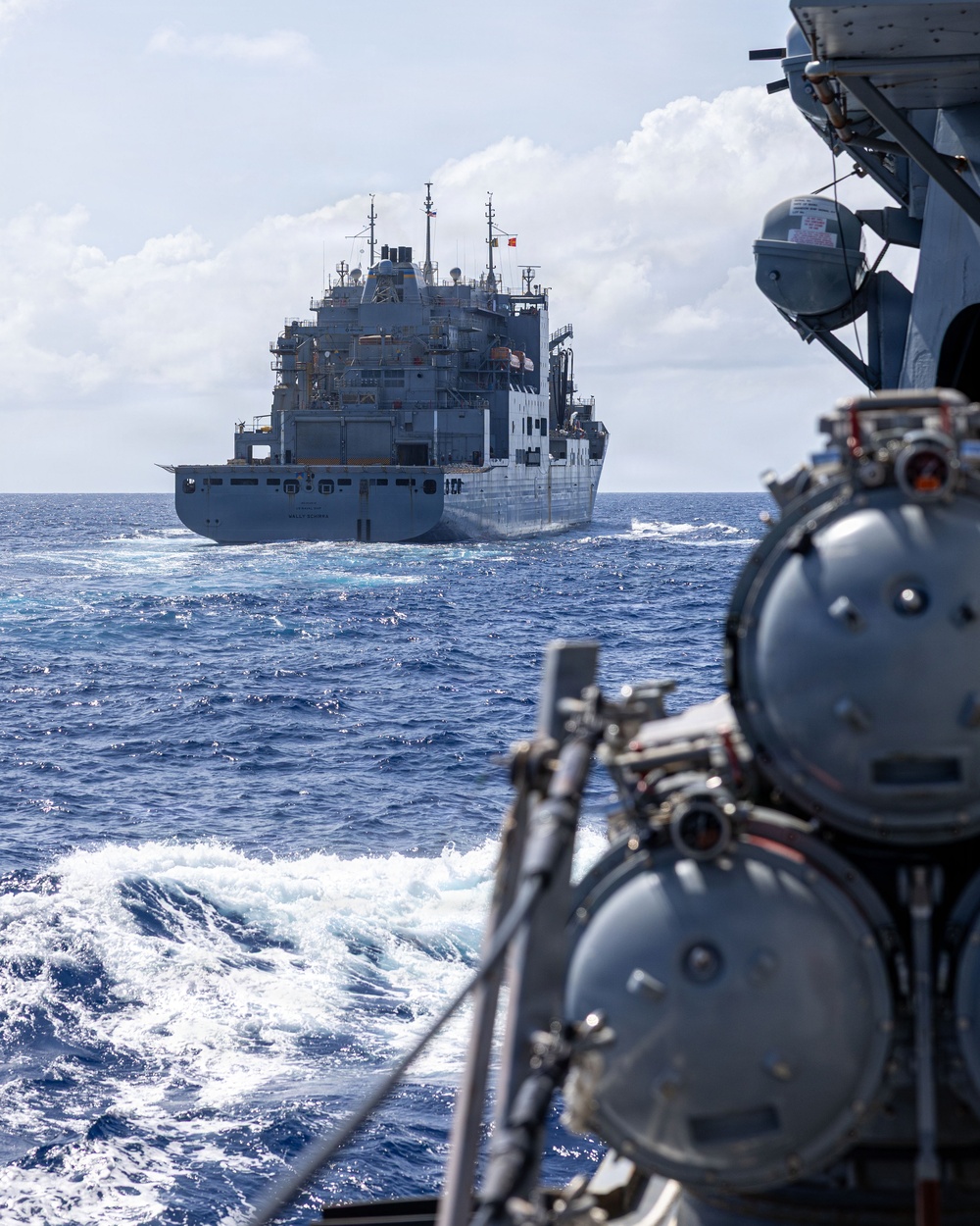 USS Mustin conducts a replenishment-at-sea with USNS Wally Schirra