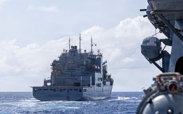 USS Mustin conducts a replenishment-at-sea with USNS Wally Schirra