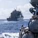 USS Mustin conducts a replenishment-at-sea with USNS Wally Schirra