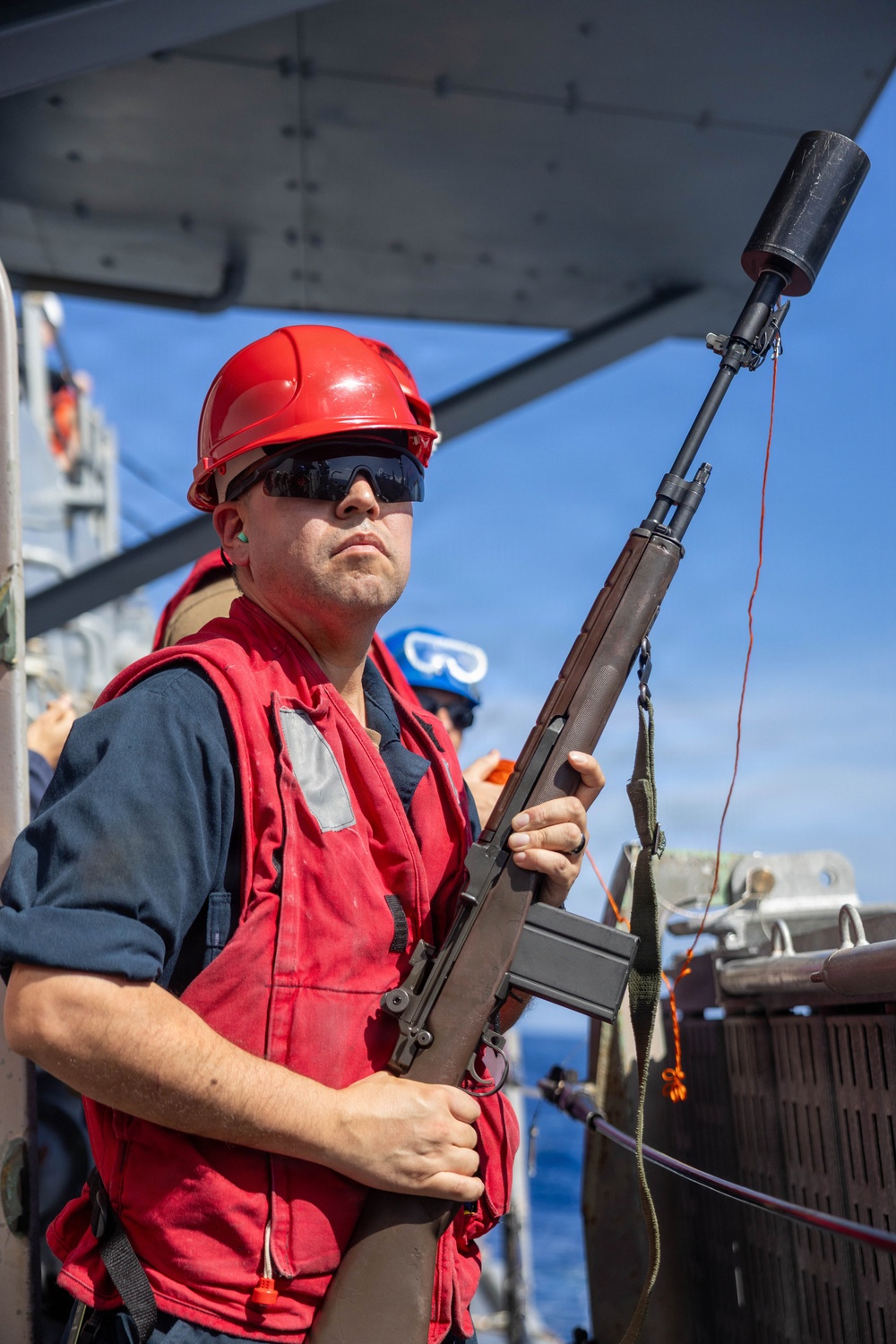USS Mustin conducts a replenishment-at-sea with USNS Wally Schirra