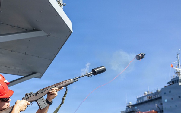 USS Mustin conducts a replenishment-at-sea with USNS Wally Schirra