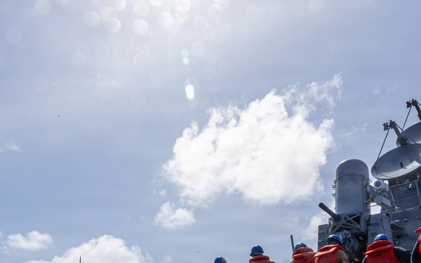 USS Mustin conducts a replenishment-at-sea with USNS Wally Schirra