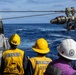 USS Mustin conducts a replenishment-at-sea with USNS Wally Schirra