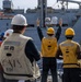USS Mustin conducts a replenishment-at-sea with USNS Wally Schirra