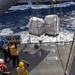 USS Mustin conducts a replenishment-at-sea with USNS Wally Schirra