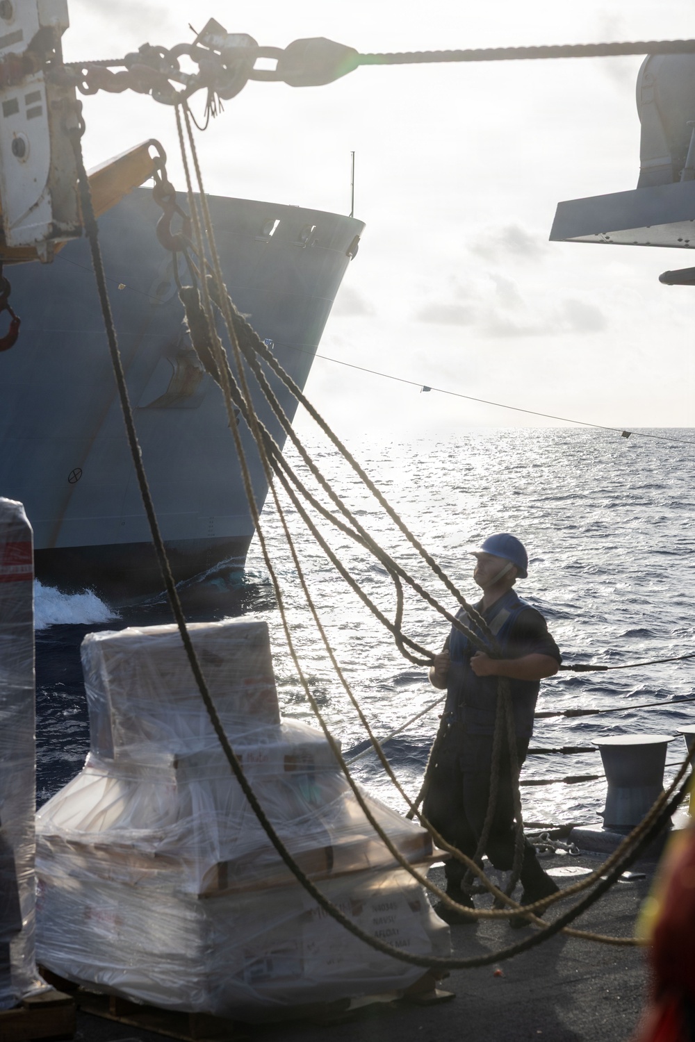 USS Mustin conducts a replenishment-at-sea with USNS Wally Schirra