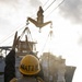 USS Mustin conducts a replenishment-at-sea with USNS Wally Schirra