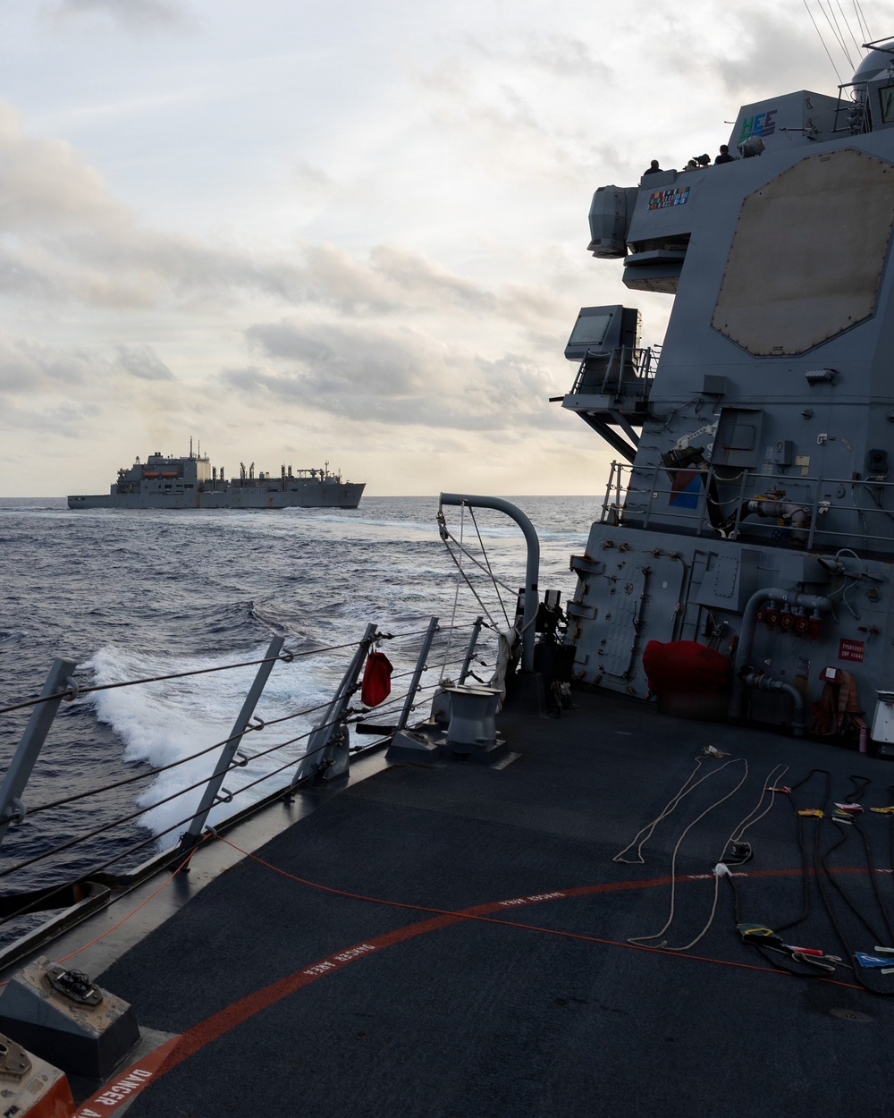USS Mustin conducts a replenishment-at-sea with USNS Wally Schirra