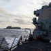 USS Mustin conducts a replenishment-at-sea with USNS Wally Schirra