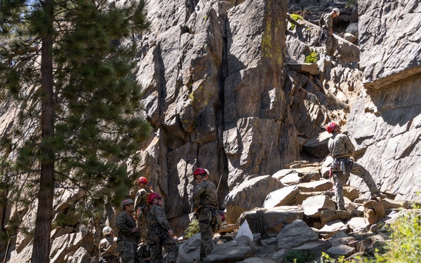 Summer Mountain Leaders Course 1-26 students test their repelling skill on Little Face