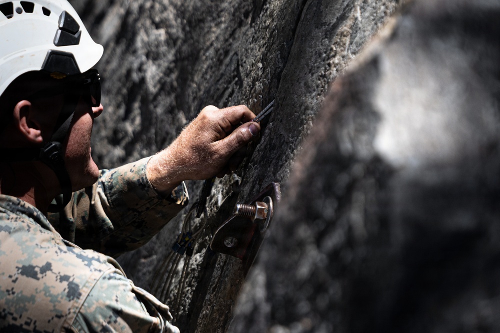 Summer Mountain Leaders Course 1-26 students test their repelling skill on Little Face