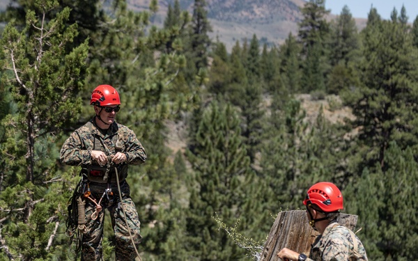Summer Mountain Leaders Course 1-26 students test their repelling skill on Little Face