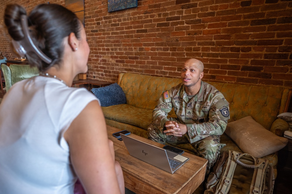 Staff Sgt. Christopher McNeil speaks to a future recruit