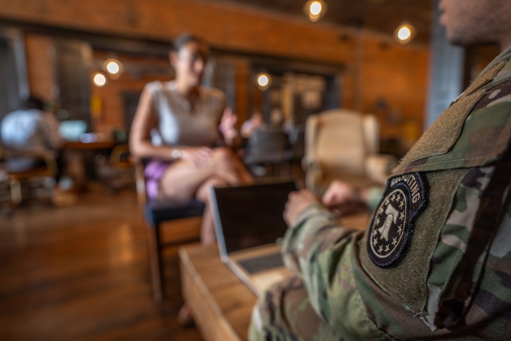 Staff Sgt. Christopher McNeil speaks to a future recruit