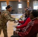 Soldier Gives Flowers to Family