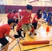 Students Compete in Team Relay Challenge During Youth Sports Event at Base Gymnasium