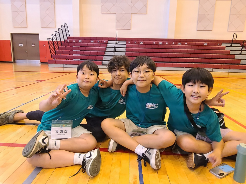 Korean and American Youth Participants Pose During the 2026 PIEFriends Summer Camp. at Camp Humphreys Gymnasium