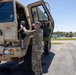 Soldier Helps Child Enter LMTV