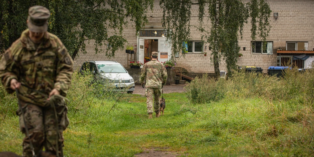 Military police and Civil Affairs Soldiers volunteer at Vilnius animal shelter