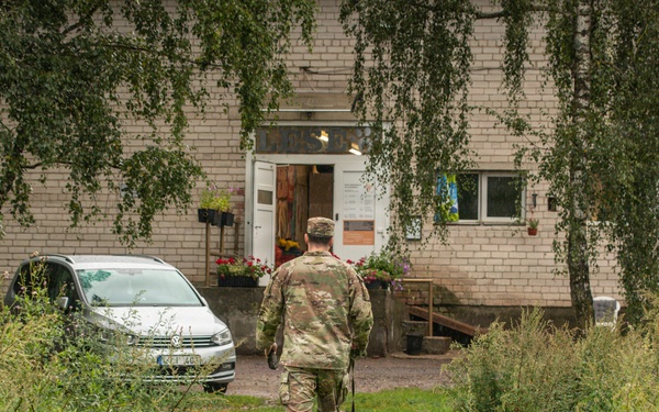 Military police and Civil Affairs Soldiers volunteer at Vilnius animal shelter
