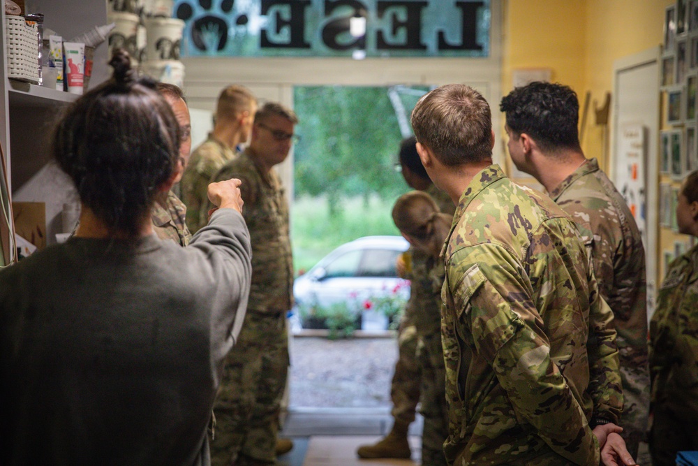 Military police and Civil Affairs Soldiers volunteer at Vilnius animal shelter