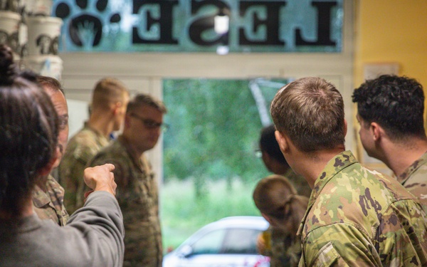 Military police and Civil Affairs Soldiers volunteer at Vilnius animal shelter