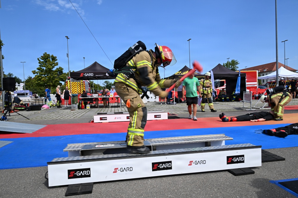 Firefighter Competes in S-GARD Combat Challenge Striking Event During Outdoor Fire Service Competition