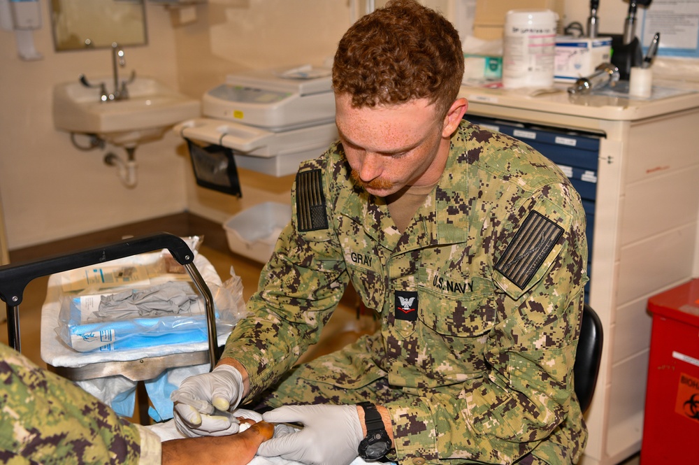 Hospital Corpsman 3rd Class Jack Gray Performs Ingrown Toe Nail Surgery