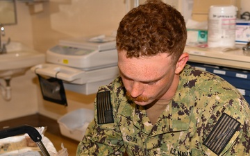 Hospital Corpsman 3rd Class Jack Gray Performs Ingrown Toe Nail Surgery