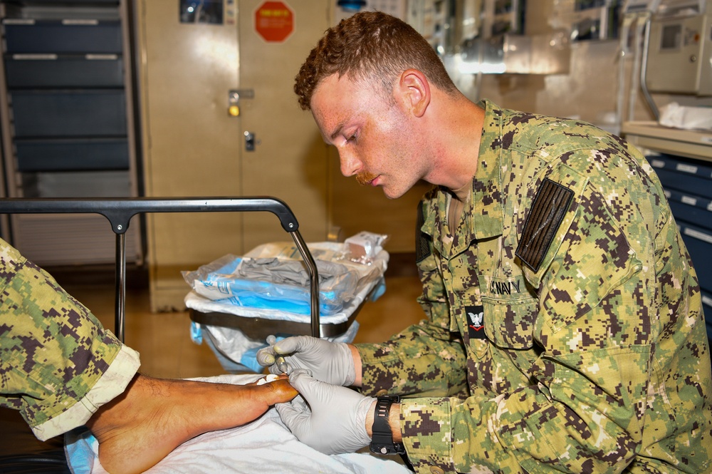 Hospital Corpsman 3rd Class Jack Gray Performs Ingrown Toe Nail Surgery