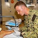 Hospital Corpsman 3rd Class Jack Gray Performs Ingrown Toe Nail Surgery