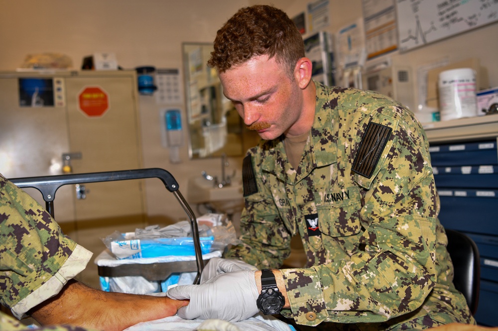 Hospital Corpsman 3rd Class Jack Gray Performs Ingrown Toe Nail Surgery