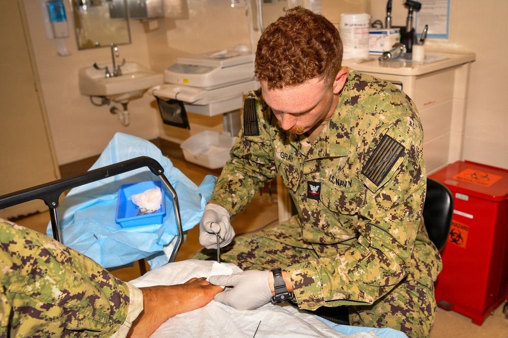 Hospital Corpsman 3rd Class Jack Gray Performs Ingrown Toe Nail Surgery