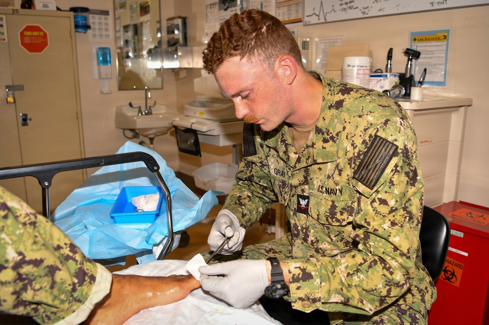 Hospital Corpsman 3rd Class Jack Gray Performs Ingrown Toe Nail Surgery