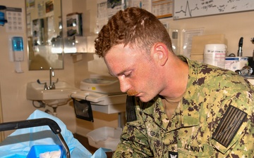 Hospital Corpsman 3rd Class Jack Gray Performs Ingrown Toe Nail Surgery