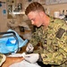 Hospital Corpsman 3rd Class Jack Gray Performs Ingrown Toe Nail Surgery