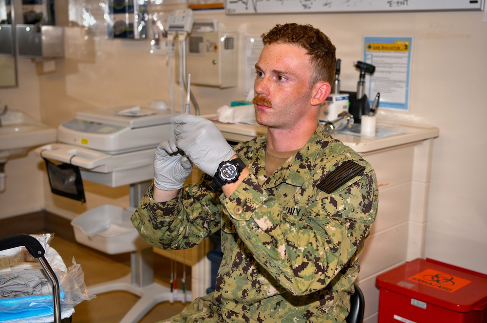Hospital Corpsman 3rd Class Jack Gray Performs Ingrown Toe Nail Surgery