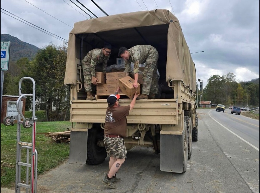 Soldiers deliver supplies in Asheville after Hurricane Helene.