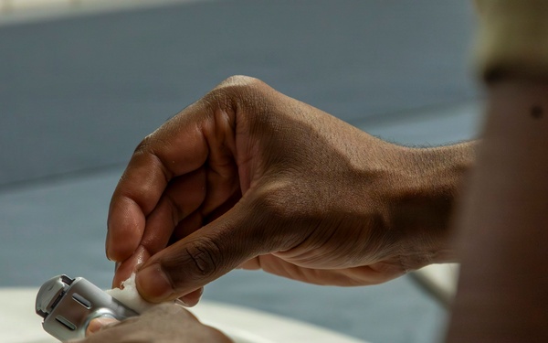 593rd CSC Soldiers Demonstrate Proper Shaving Techniques