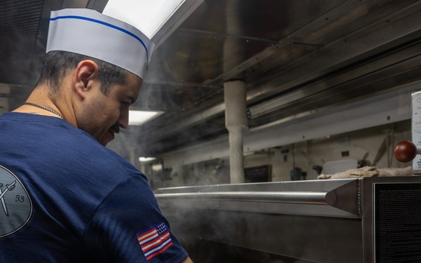 John Paul Jones Sailor Prepares Meal