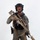 MCAS Marines pose for content 2026 A person in full tactical/military-style gear is posed against a plain white background in what appears to be a studio or promotional photograph. They are equipped with a large precision rifle with a suppressor and scope, body armor, helmet, and sidearm. The image appears to be a professional equipment showcase or gear demonstration photo.